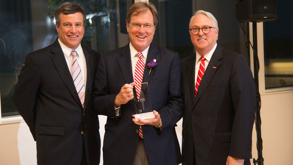 Richard K. Bryant, center, was presented the 2015 Godwin Award by Chancellor Randy Woodson and Trent Ragland, vice chair of the Foundation Board of Directors.