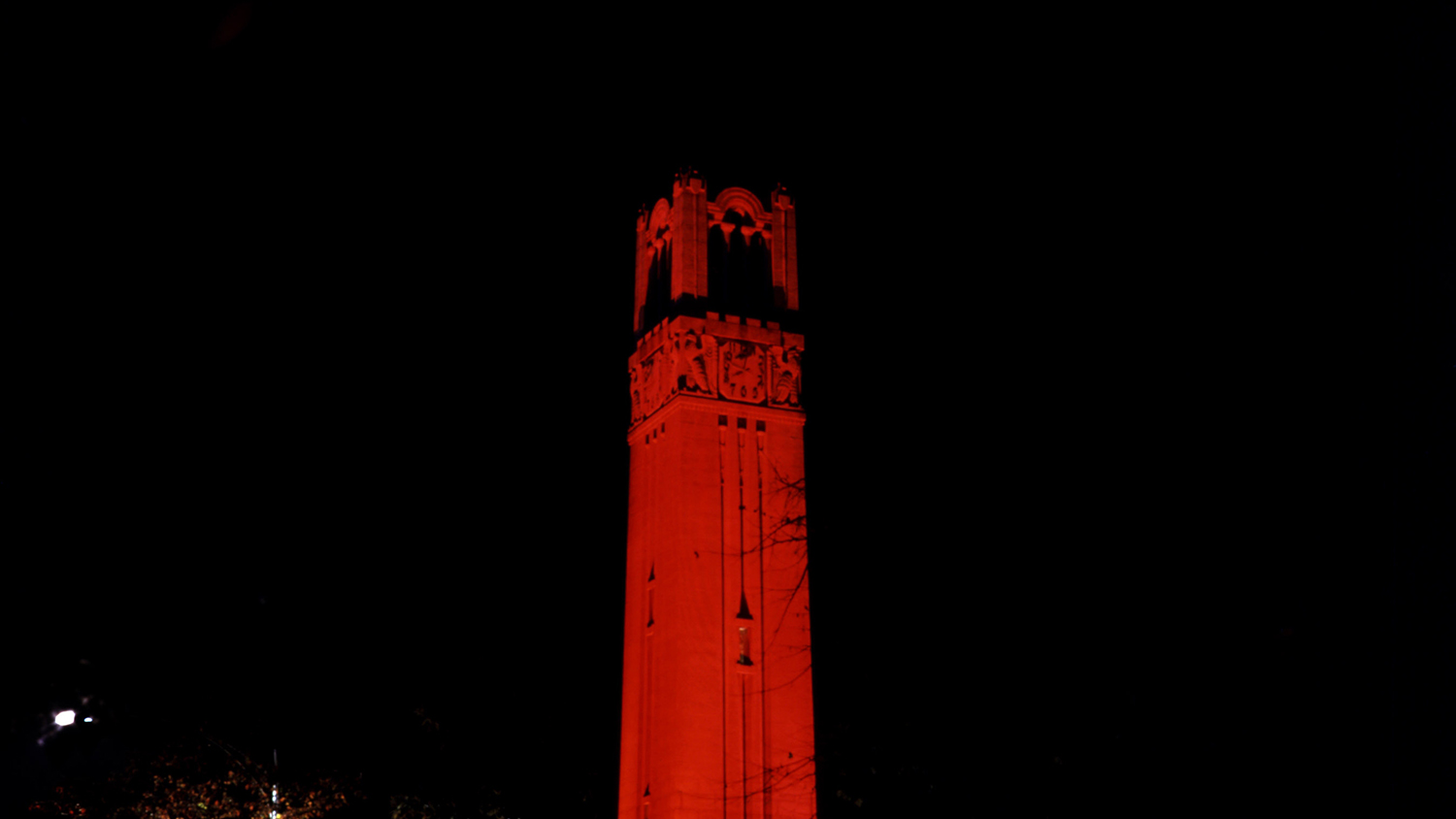 Memorial Belltower lit up red