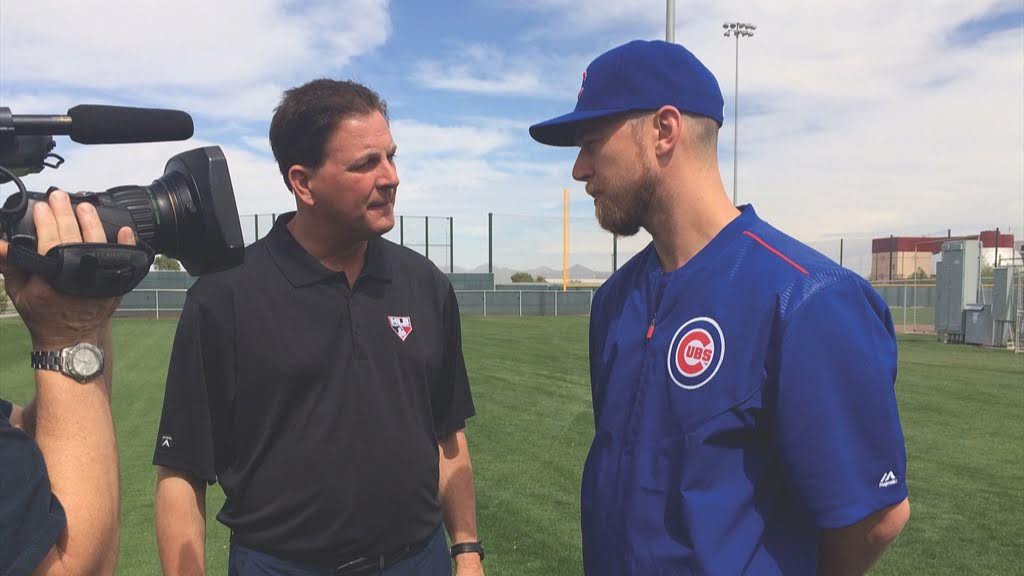 Dan Plesac talks to Cubs player on field