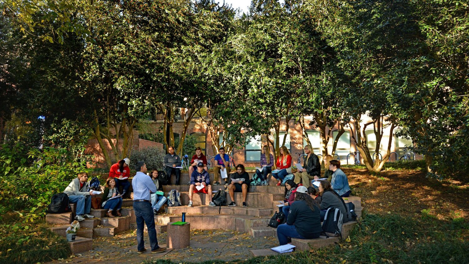 Students meet for class in courtyard outside Tompkins Hall