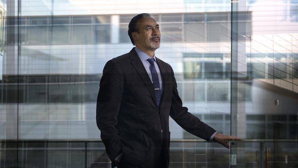 Phil Freelon in front of office glass