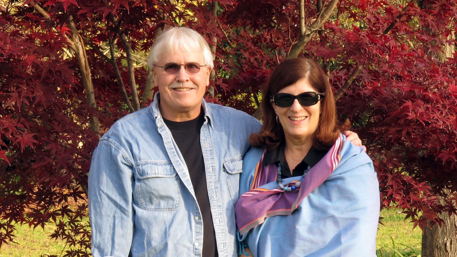 Scott and Rebecca Rothney in front of Japanese maple tree