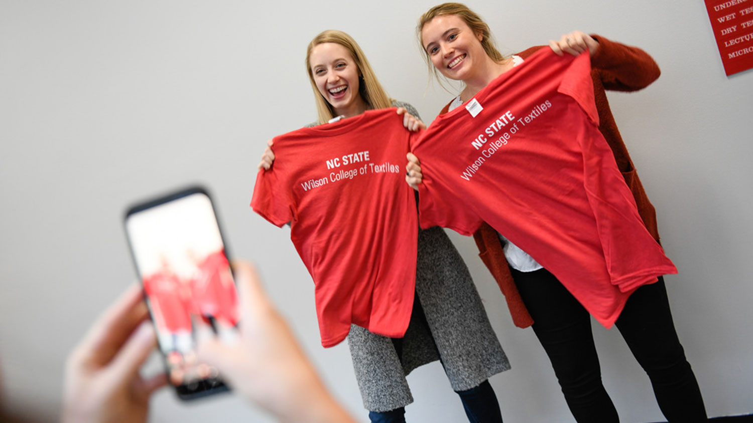 Students pose with new Wilson College of Textiles shirts