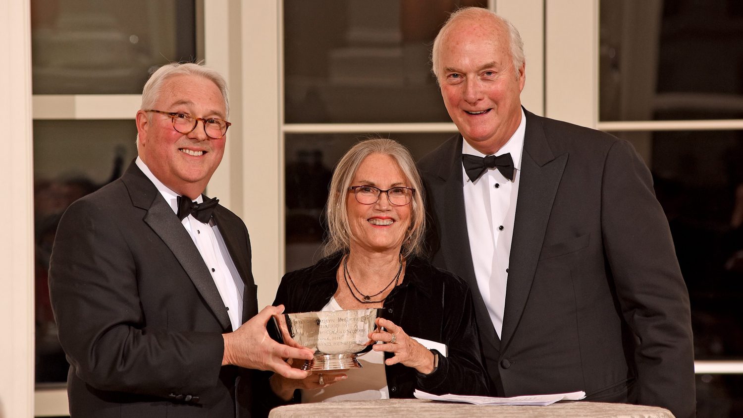 Chancellor Woodson, Adelaide Gomer and Charlie Stallings with the Menscer Cup