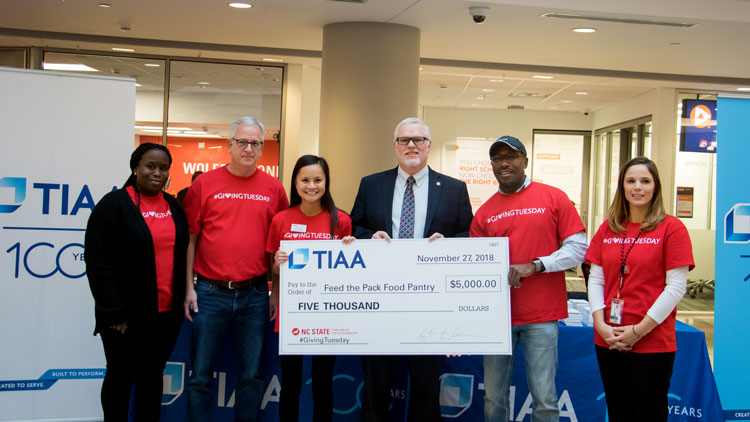 Giving Tuesday volunteers with TIAA donation