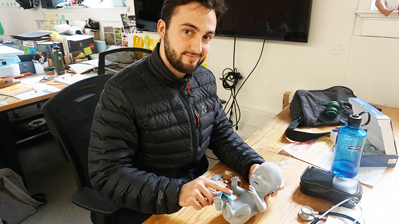 Will Reuther with baby monitoring prototype
