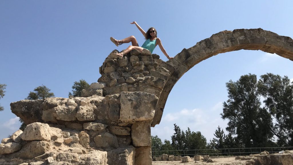 Erin Gniewek poses on rocks in Cyprus