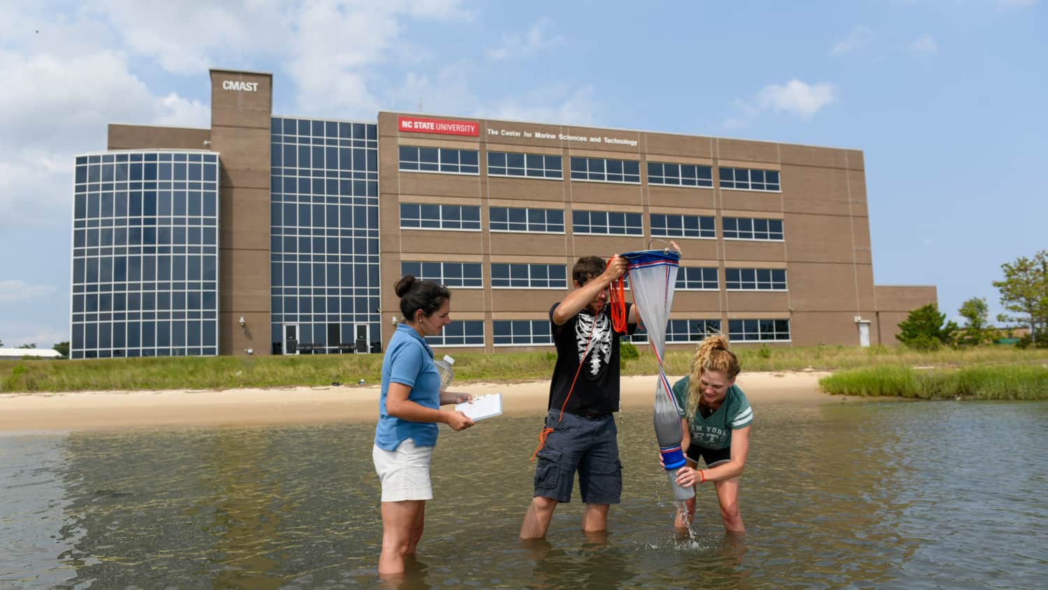 students conducting research in water at the center for marine sciences and technology