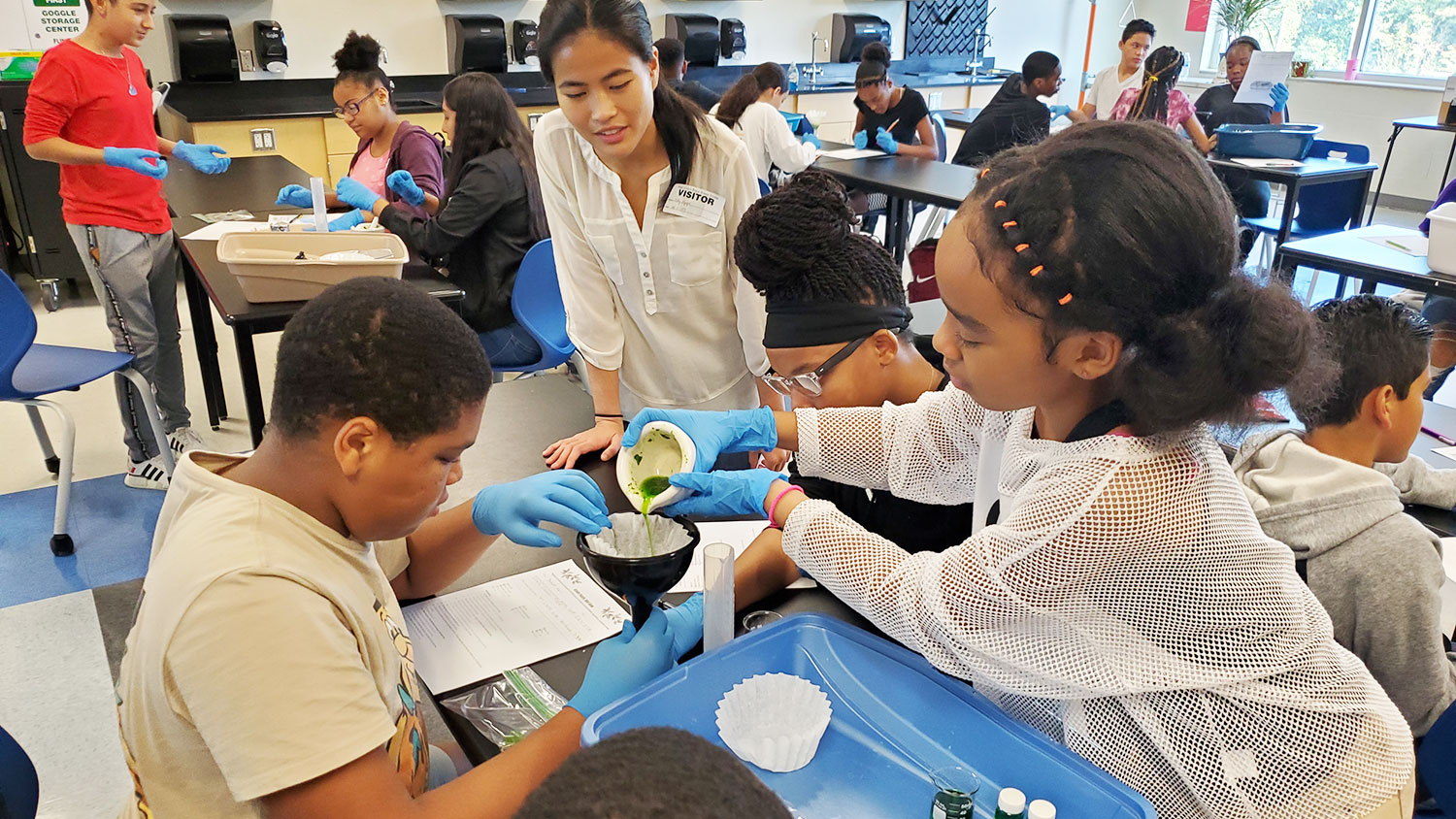 elementary school students conducting an experiment through Science House