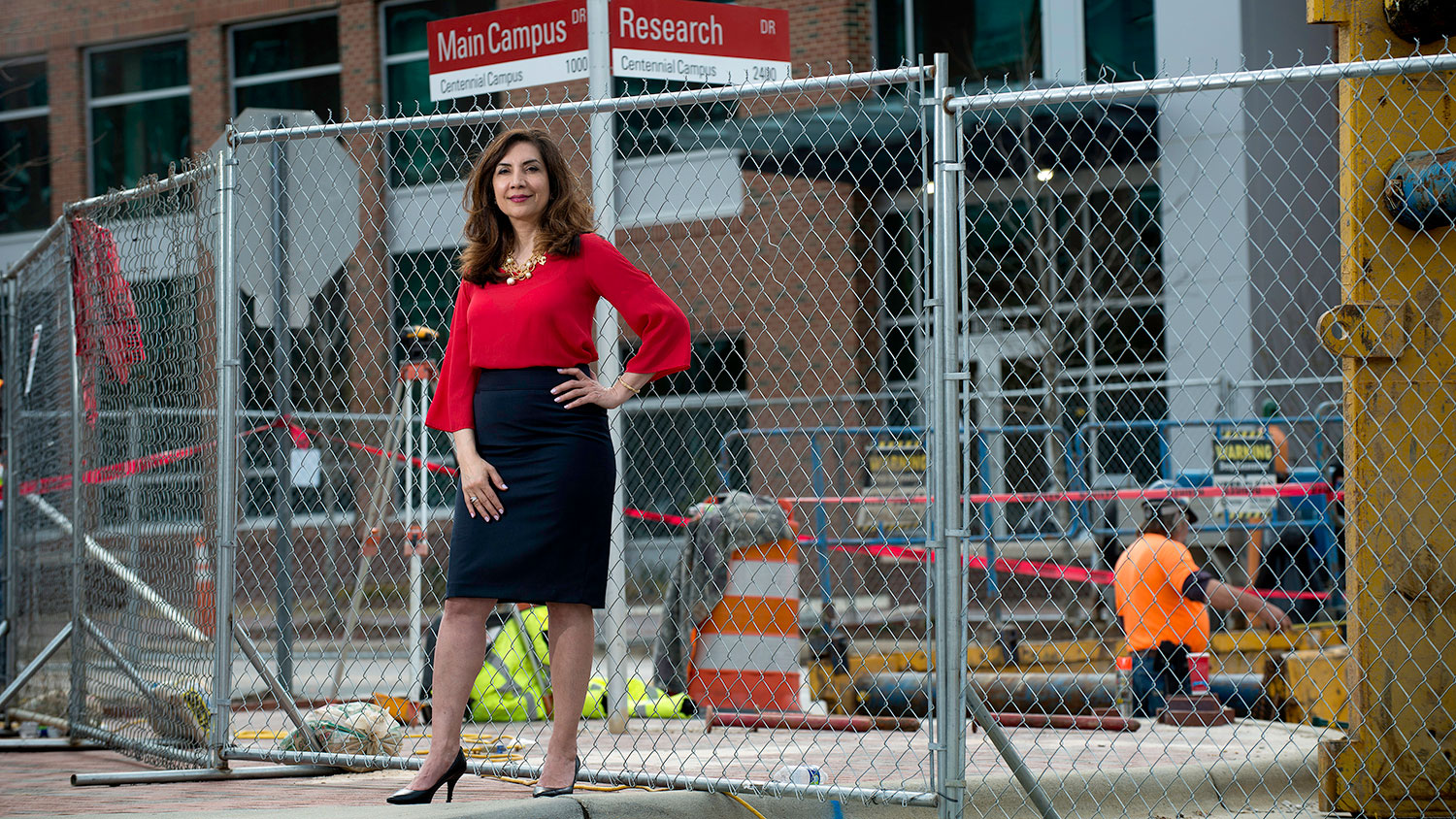 sepi saidi poses in front of a construction site