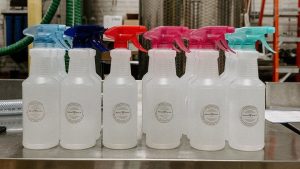 spray bottles of sanitizer in the distillery