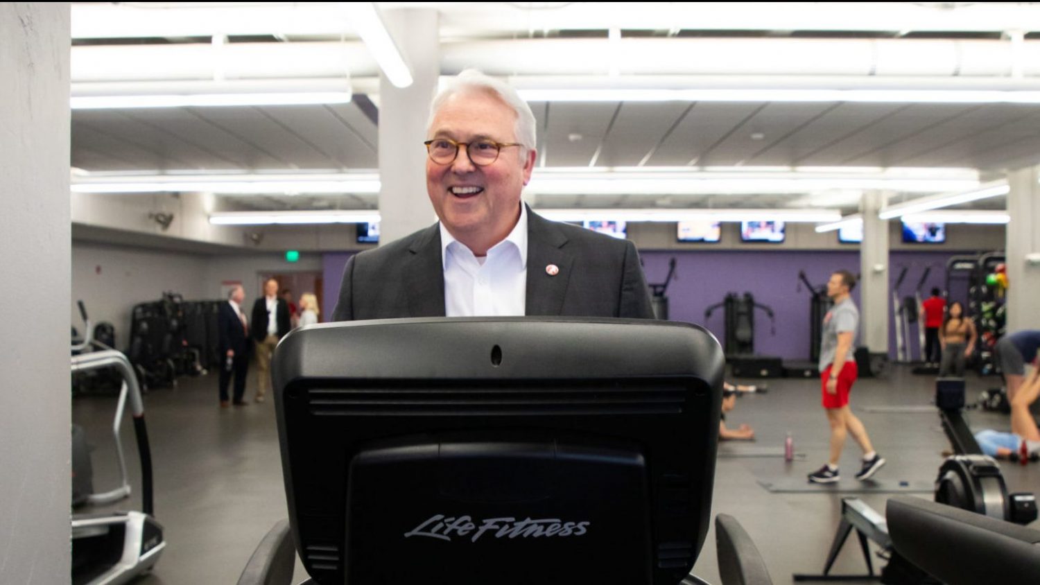 Chancellor Woodson smiling on a treadmill