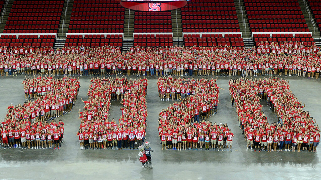 students stand in REynolds to form the numbers 2020