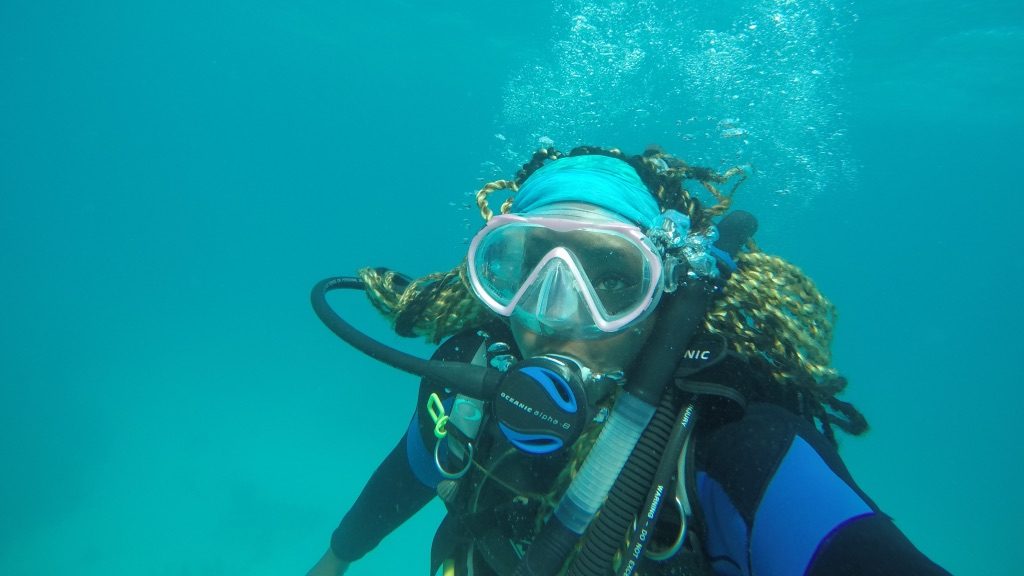 Kayelyn SImmons underwater in scuba gear
