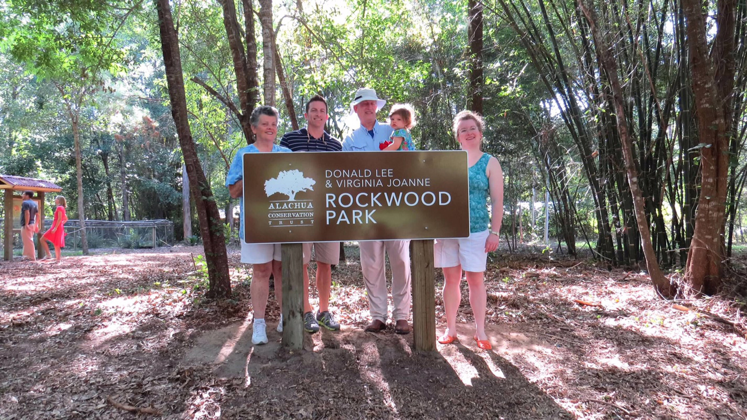 Rockwood family posing in front of Rockwood Park sign