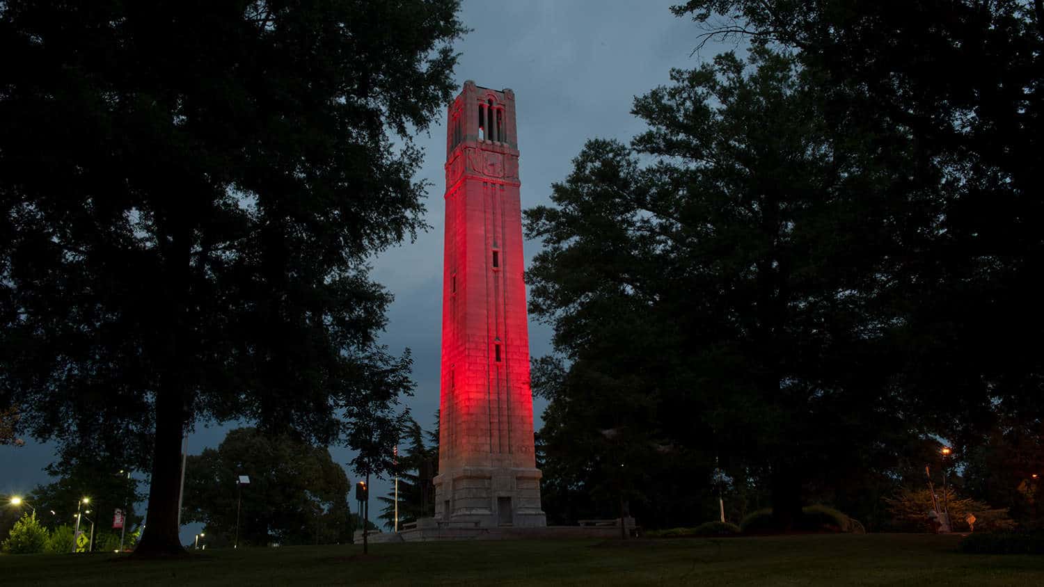 The memorial belltower lighted red.