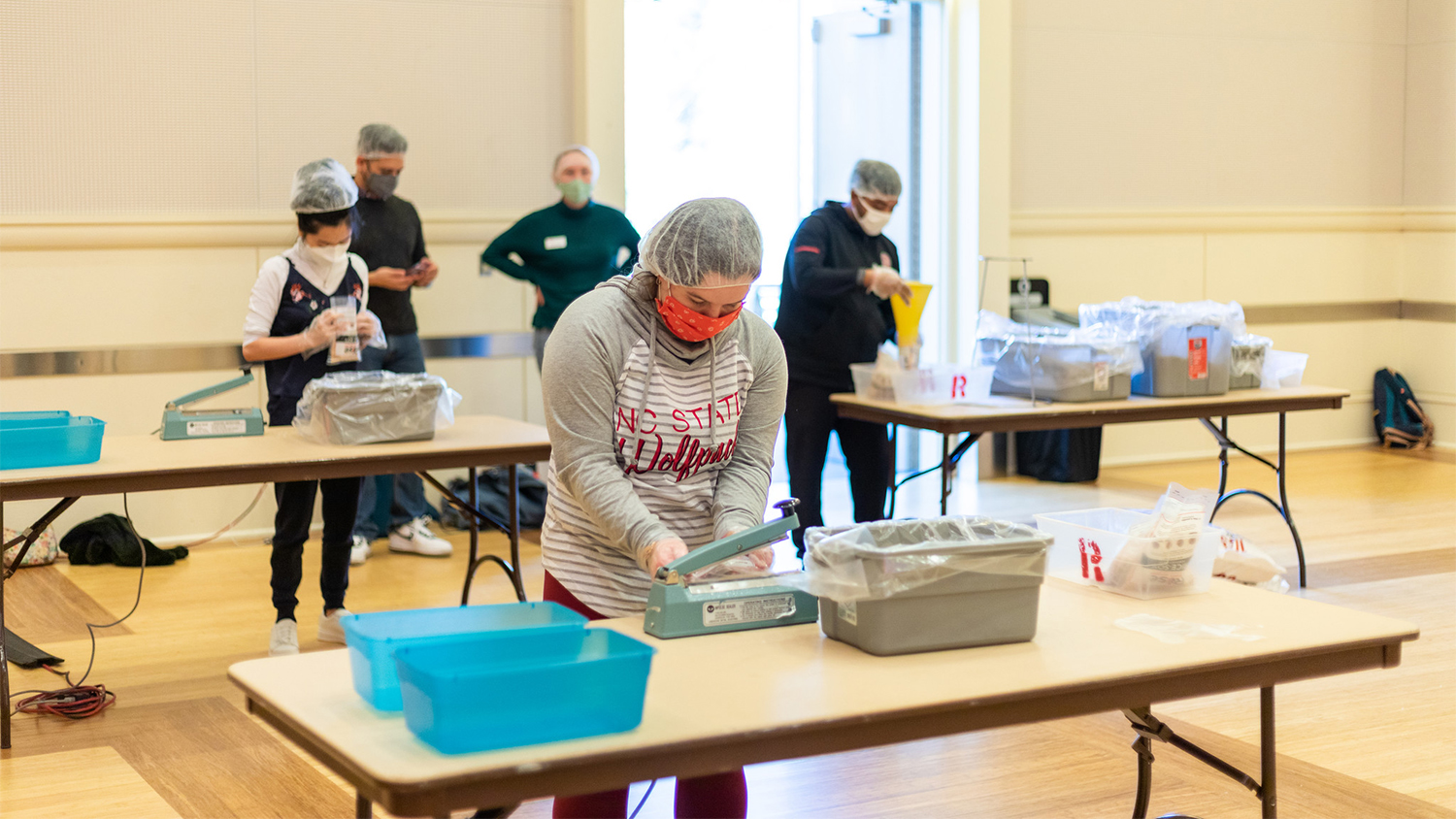 Students package meals at the Rise Against Hunger event in Talley Student Union during Winter Welcome Week