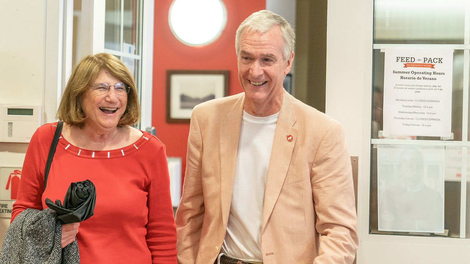 Dean Jeff Braden and his wife, Jill, walk into NC State's Feed the Pack Pantry on June 25