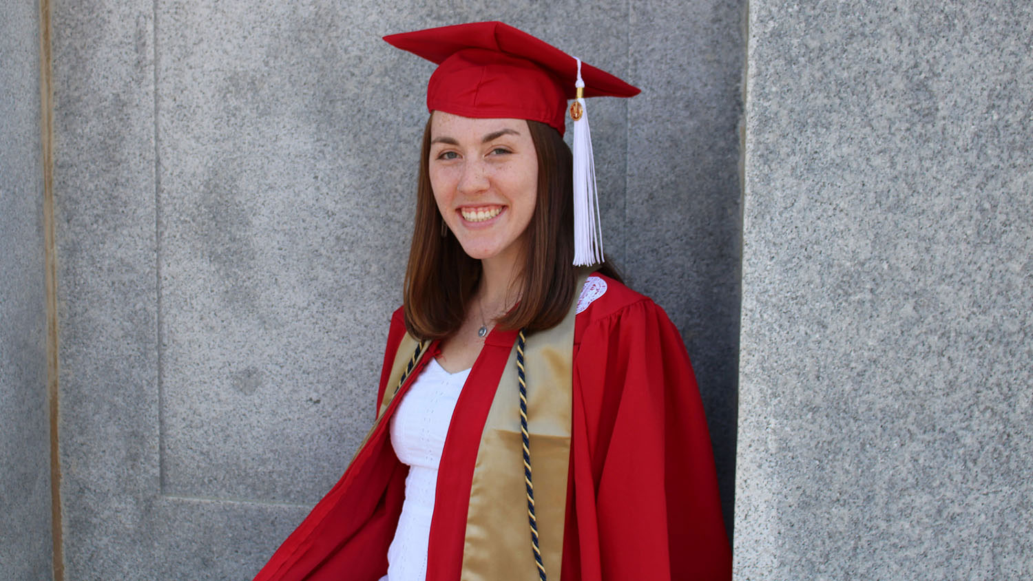 Sarah Brown in her cap and gown at the foot of the Belltower