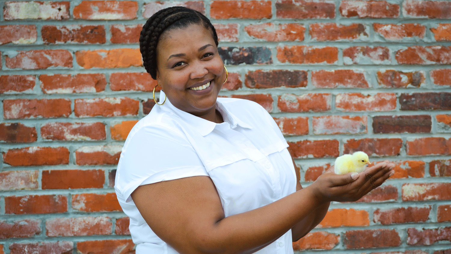 Ebony Harris holding a chick