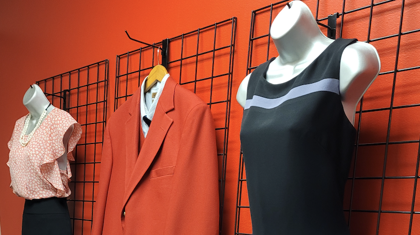 hanging clothing forms display professional outfit options at the clothing closet