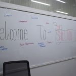 A white board with a welcome message to the Shelton Suite.