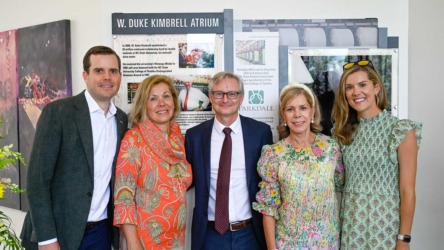 A memorial display was unveiled to honor distinguished alumnus W. Duke Kimbrell ’49 in the college's W. Duke Kimbrell Atrium. In attendance at the unveiling ceremony were Dean David Hinks (center) and Kimbrell's daughters and grandchildren: (l-r) Davis Warlick, Shepard Halsch, Pamela Warlick and Collins Byers.
