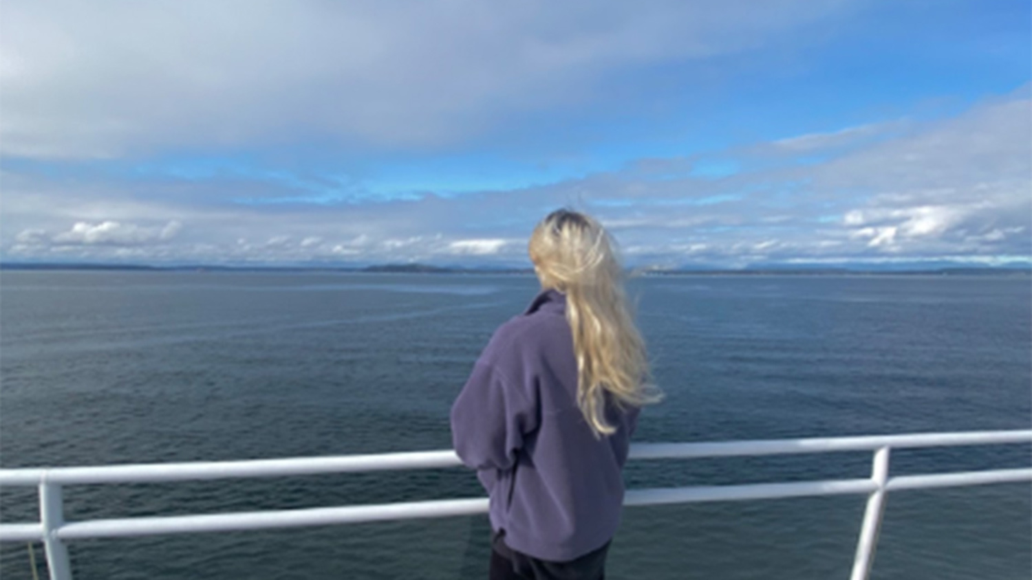 Madeline Ellis looking at the ocean