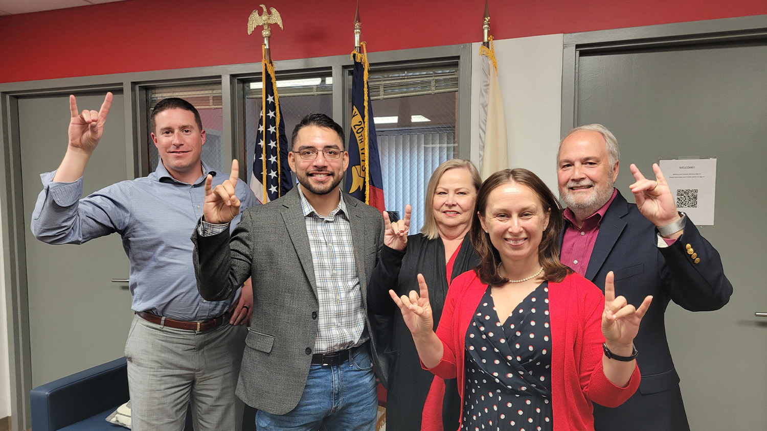 From left, Nick Drake, Jose Hernandez, Shirley Scott, Lauren Welch and Carroll "Scotty" Scott pose for a photo in the office for Jeffrey Wright Military and Veteran Services.