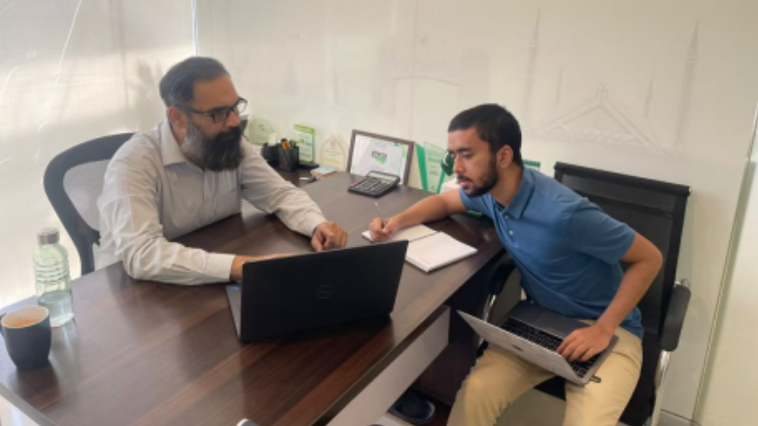 Mohhid Kidwai working with a professor in Islamabad, Pakistan