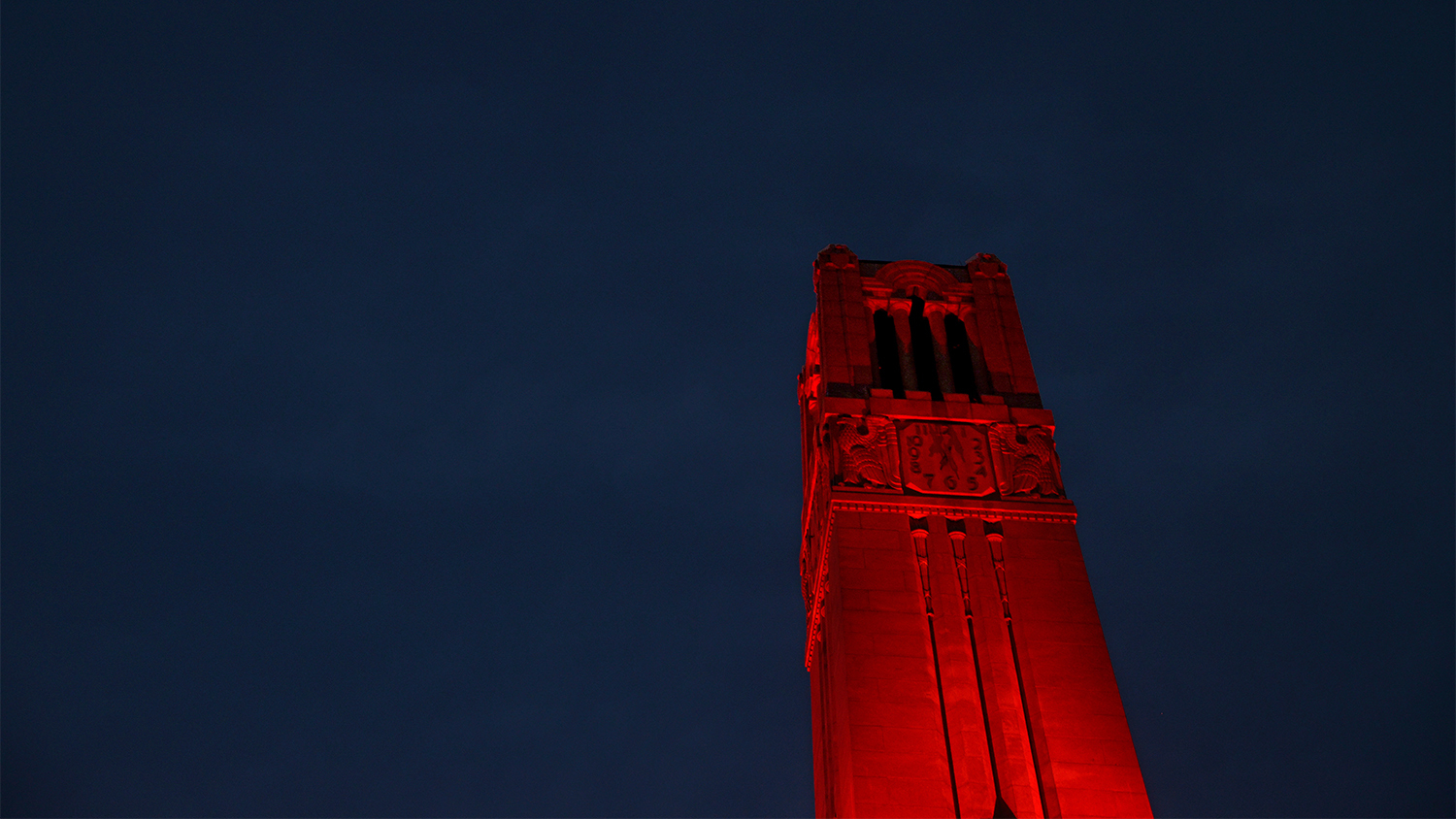 The Belltower, lit red in honor of an ACC basketball win.