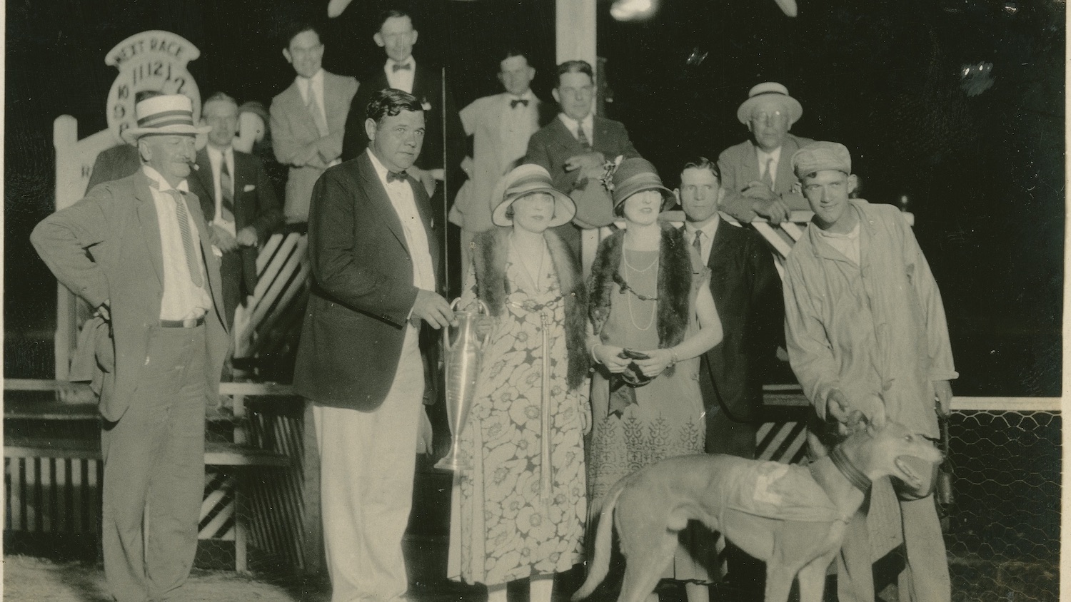 Baseball legend Babe Ruth poses with other spectators with a winning greyhound Racing Ramp at the Derby Lane Greyhound Track in St. Petersburg, Florida, in 1925.