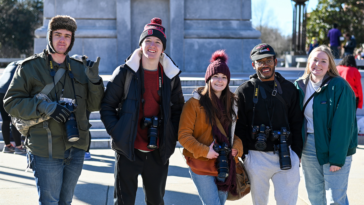 Left to right: Oscar Codes Bodien, Reilly Witte, Dani Meyer, Jermaine Hudson and Hallie Walker of the Technician photography team in front of the Belltower