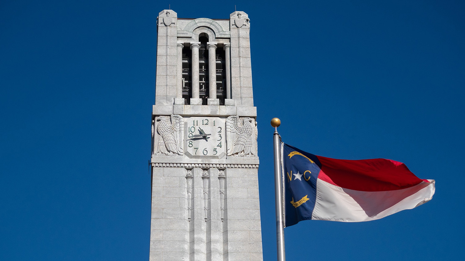 NC flag in front of the Belltower