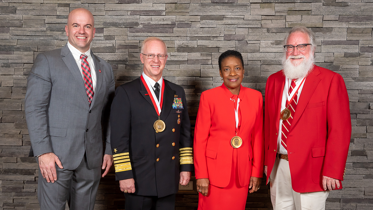 Dean Jim Pfaendtner, left, is shown with 2023 Distinguished Engineering Alumni Award recipients, from left, Admiral Daryl L. Caudle, Deborah Bell Young and Robert E. Troxler.
