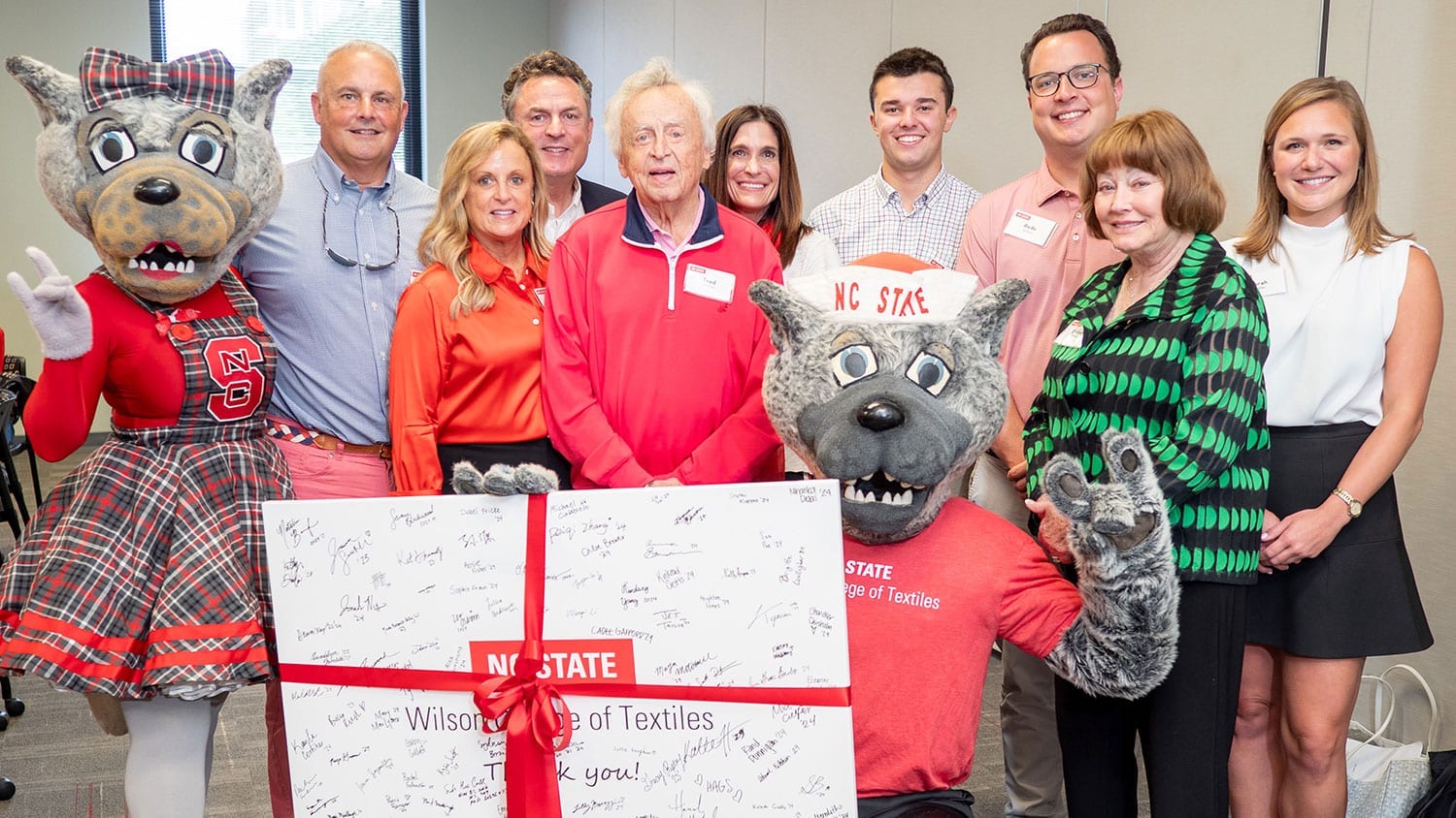 From left: Ms. Wuf, Mike Calabrese, Cres Wilson Calabrese '89, Rick Wilson '87, Fred Wilson '61, Sondra Wilson, Michael Calabrese, Mr. Wuf, Rede Wilson '16, Barbara Wilson and Sarah Butler.