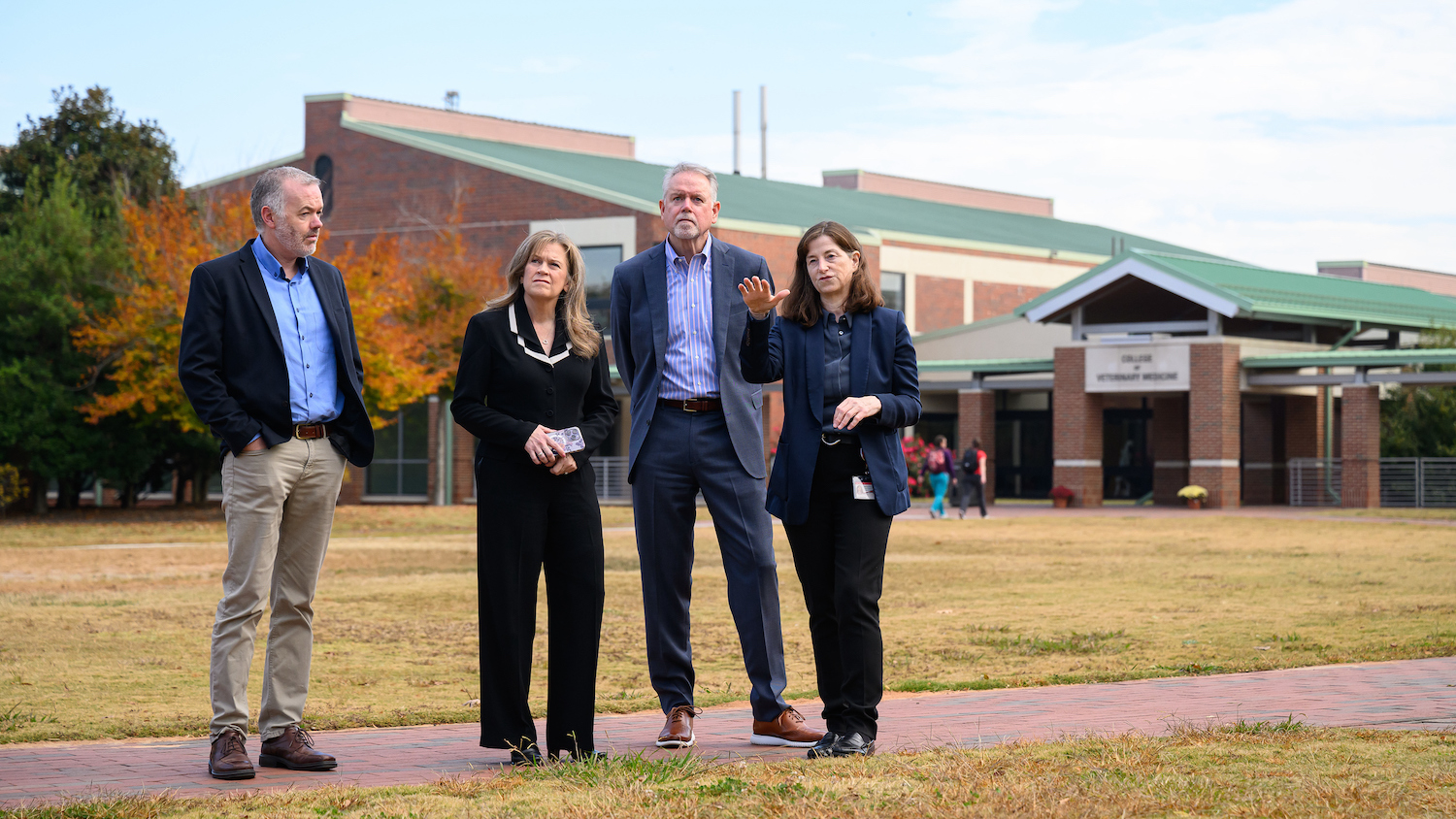 Dr. Kate Meurs, far right, takes Dr. Stuart Fitzgerald, chief scientific officer at TriviumVet, Dr. Dottie Cimino Brown, chief scientific officer at Mars Veterinary Health, and Dr. Mike McFarland, executive vice president and chief medical officer at Zoetis, on a tour of the NC State College of Veterinary Medicine campus.