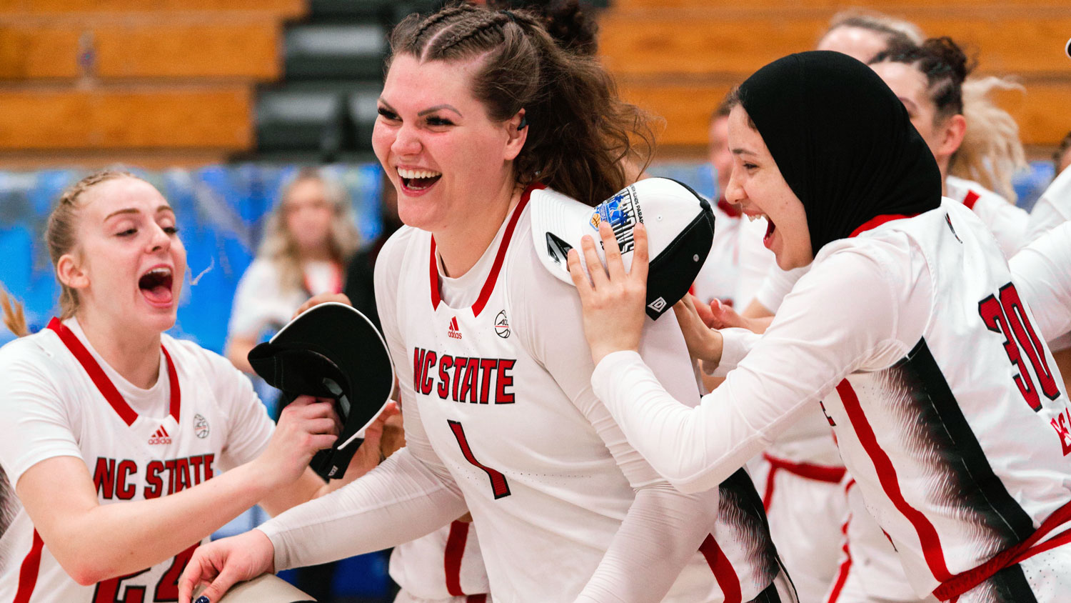 NC State center River Baldwin's teammates congratulate her for a career-best game against No. 3 Colorado.