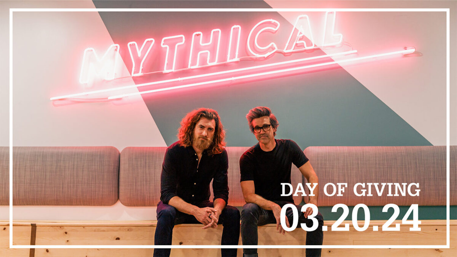Rhett McLaughlin and Link Neal in front of a "Mythical" sign.