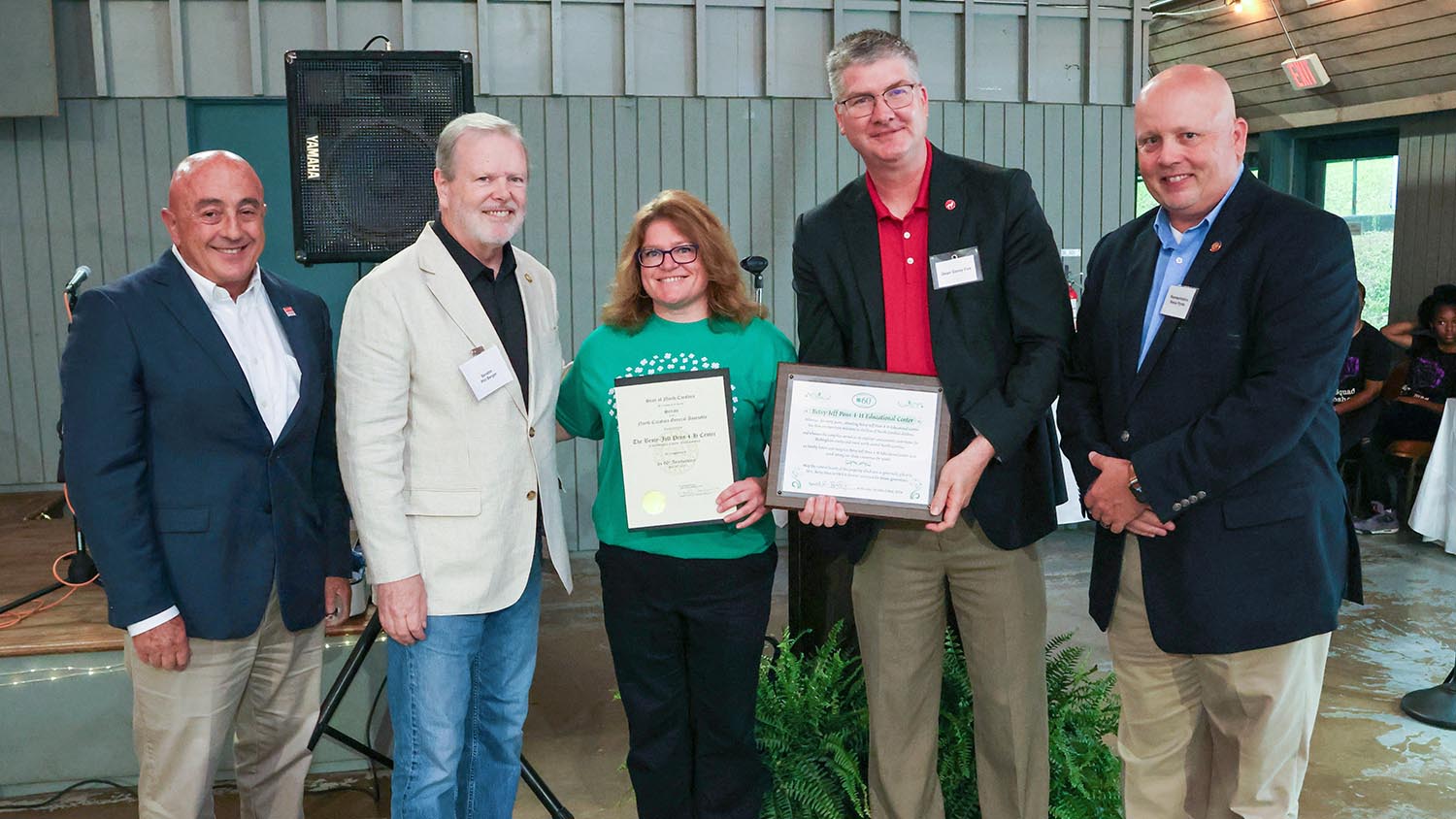 NC State Extension Director Rich Bonanno, state Senate Leader Phil Berger, Betsy-Jeff Penn 4-H Center Director Stacy Burns, CALS Dean Garey Fox, and North Carolina Rep. Reece Pyrtle with certificates presented to the center to commemorate the 60th anniversary.