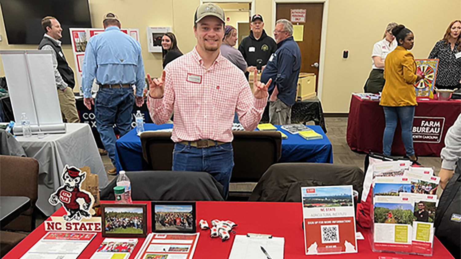 Charles McGhee at an AGI booth during a career and college fair in Surry County.