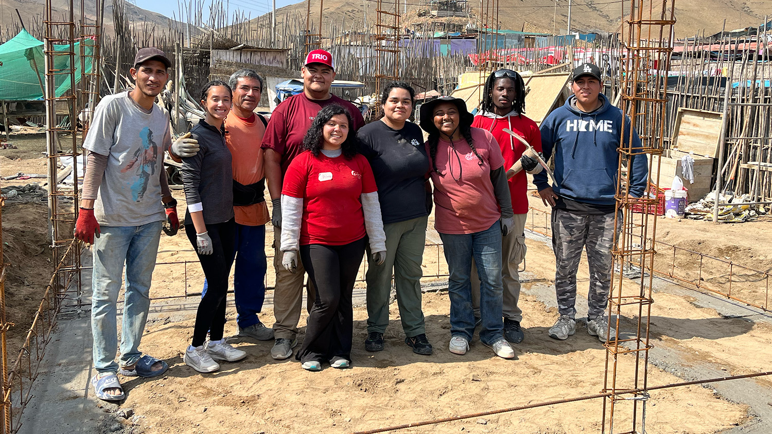 Members of the TRIO Pre-College and Collegiate Programs standing at a construction site