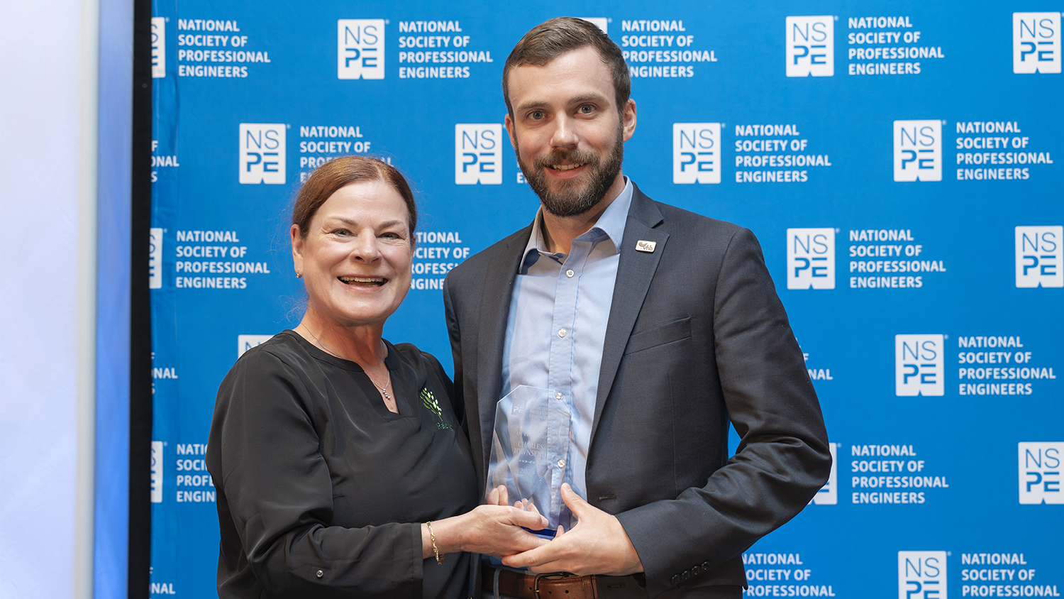 Charlie Townsend, right, with Raleigh Mayor Mary-Ann Baldwin after receiving the New Professional Engineer of the Year. Photo courtesy of VHB.