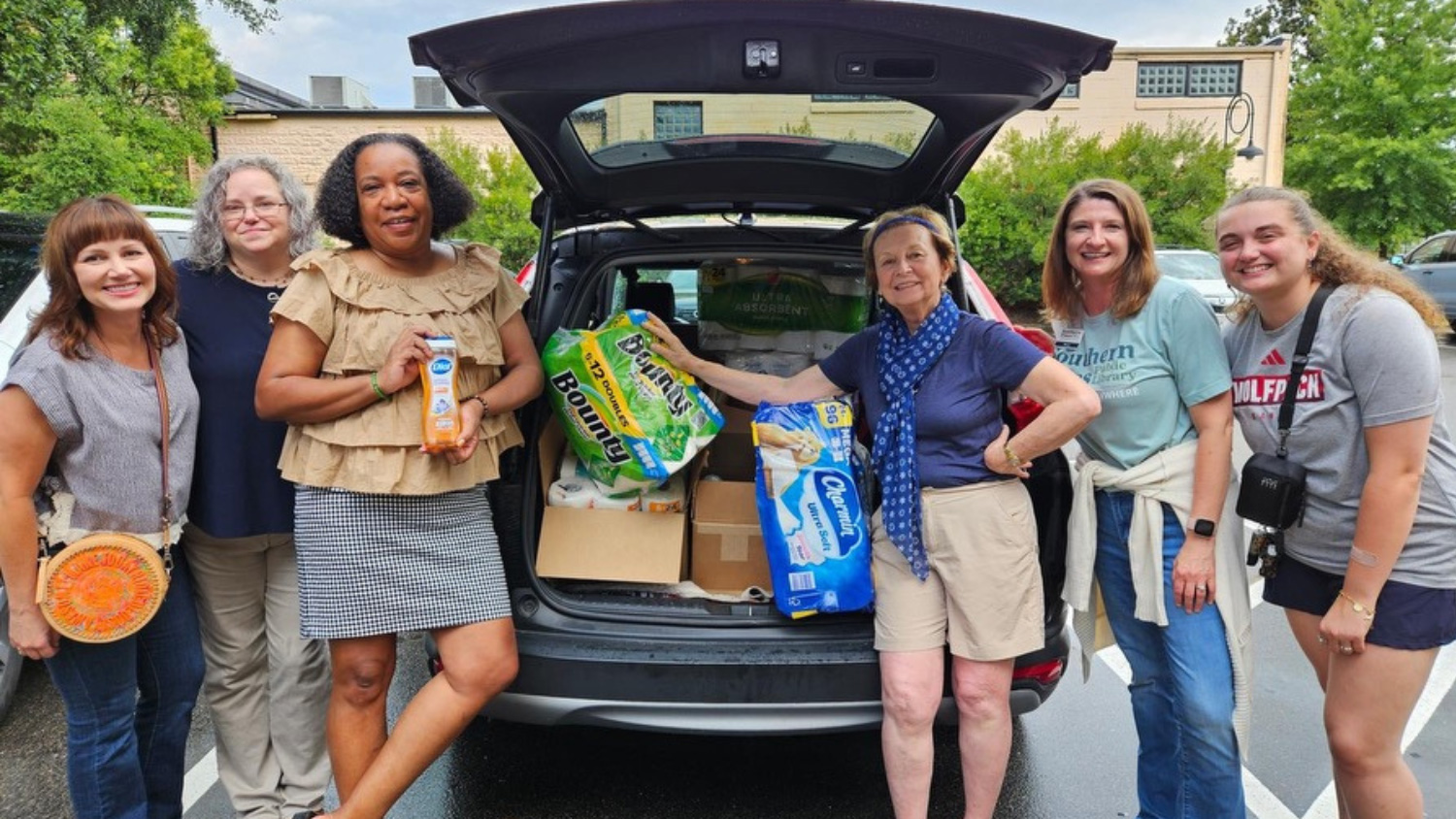 Molly Sue Smith, far right, with the staff of Tambra Place, an organization that provides a safe, social learning environment for young people facing housing insecurity.