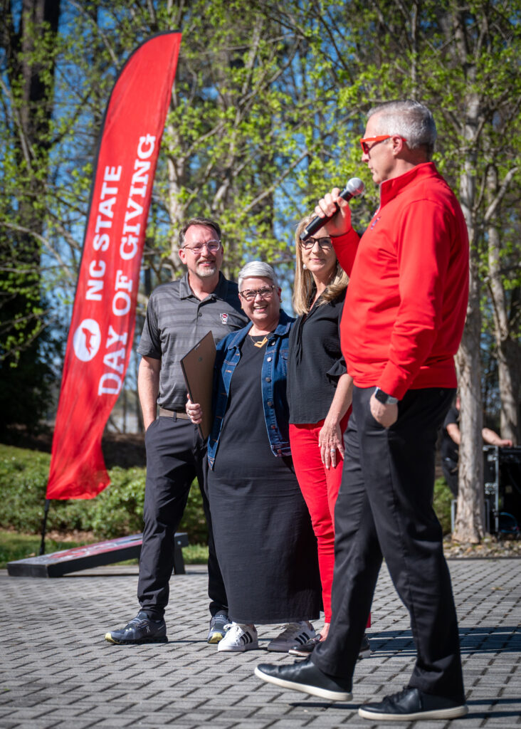 Vice Chancellor for University Advancement Brian Sischo (right) comments on the creation of the Foulkrod-Klingler Special Events and Experiences Endowment during the 2024 Day of Giving event while Ellen Klingler (second from left) and the Foulkrods stand by.