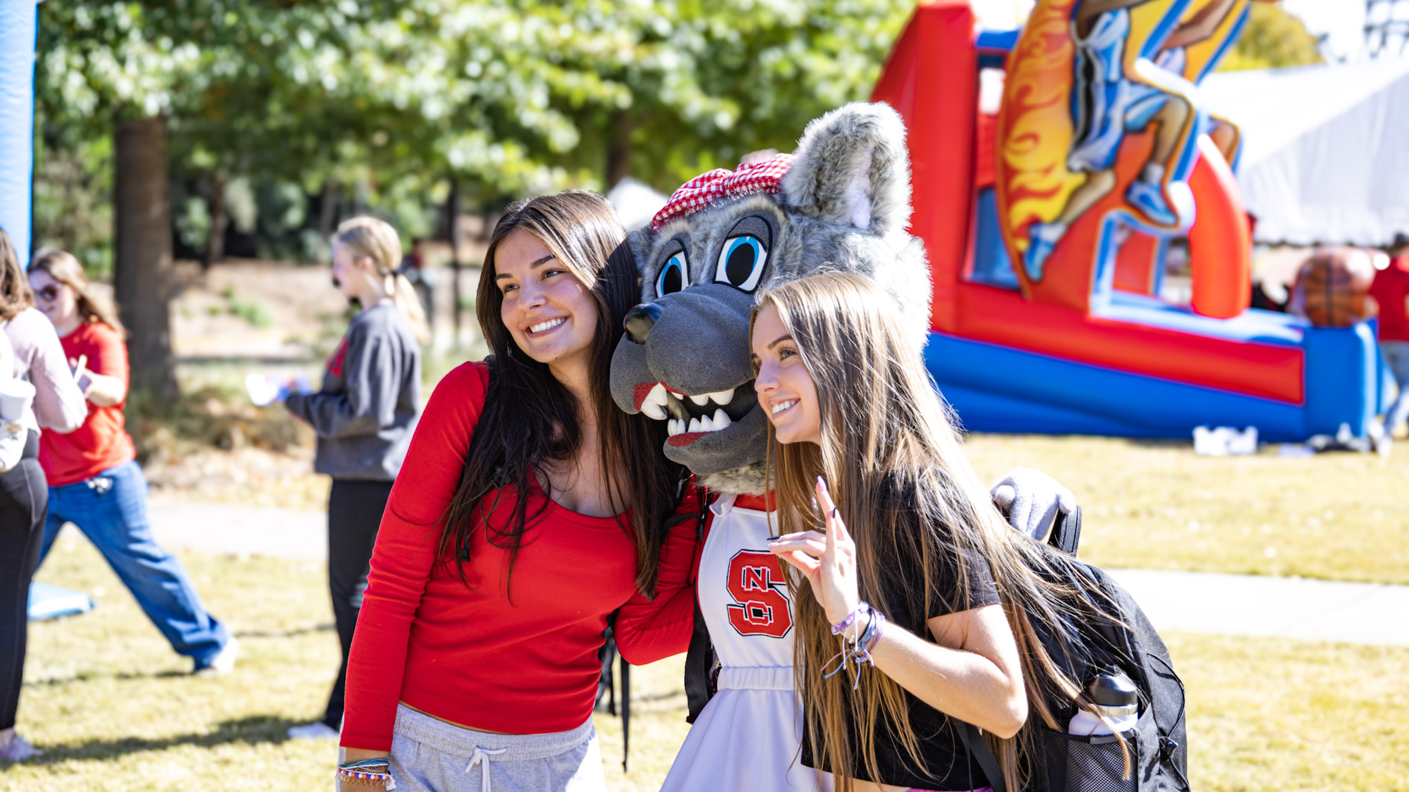 Ms. Wuf poses with students at Pack Appreciation Day