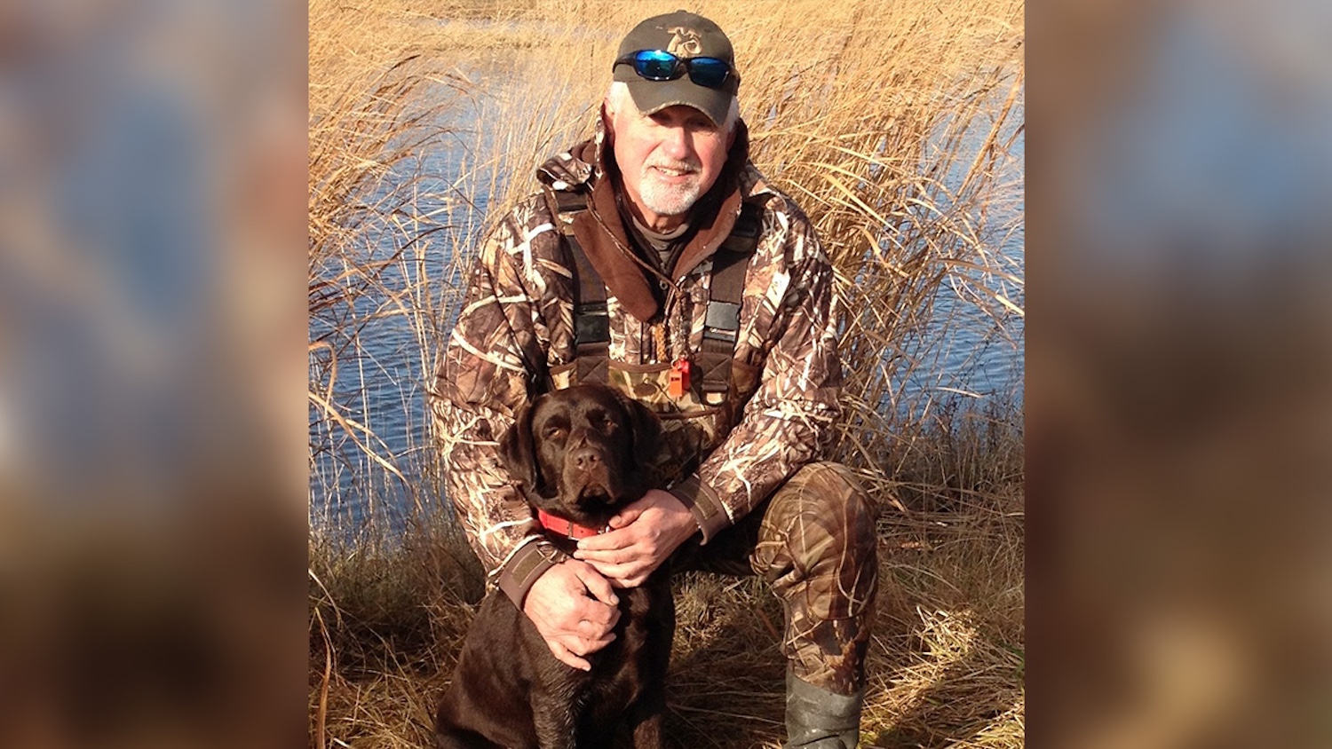 Art Aikin and his chocolate lab, Cooper