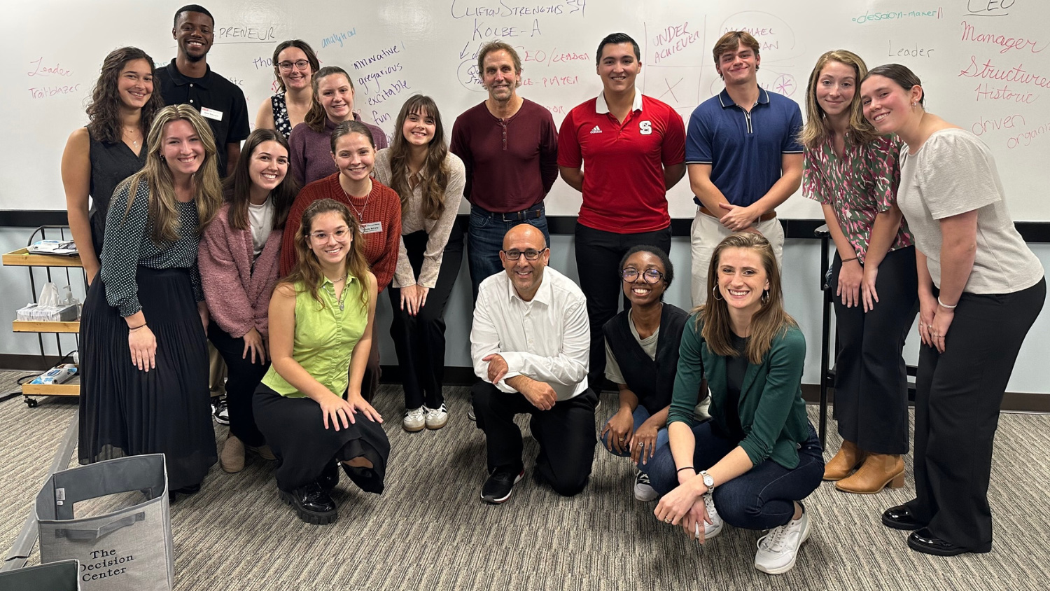 Jason Bocarro (center) and the first cohort of Buzzard Fellows at the Randy Nelson Decision Center.