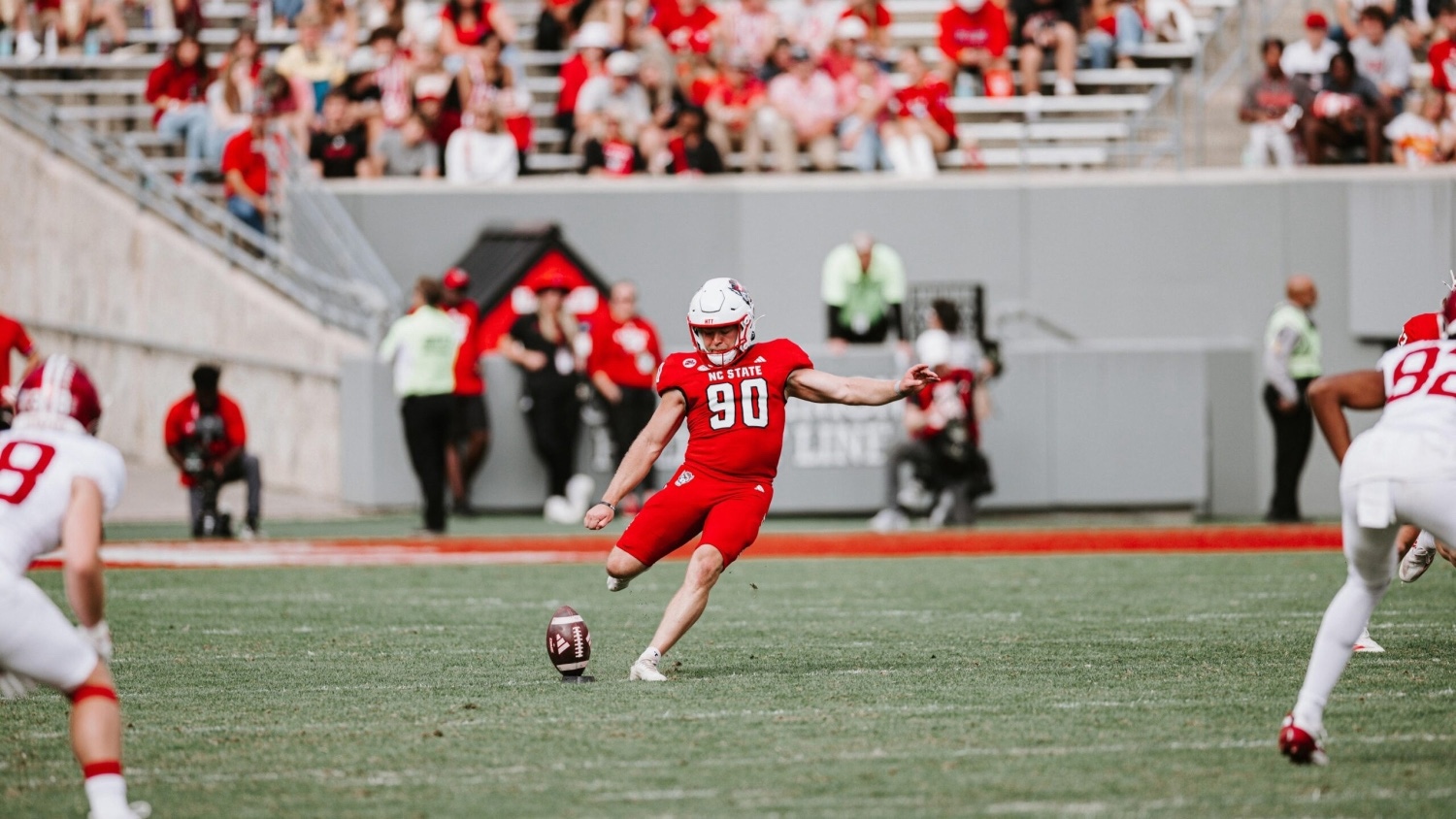 Collin Smith kicking a football