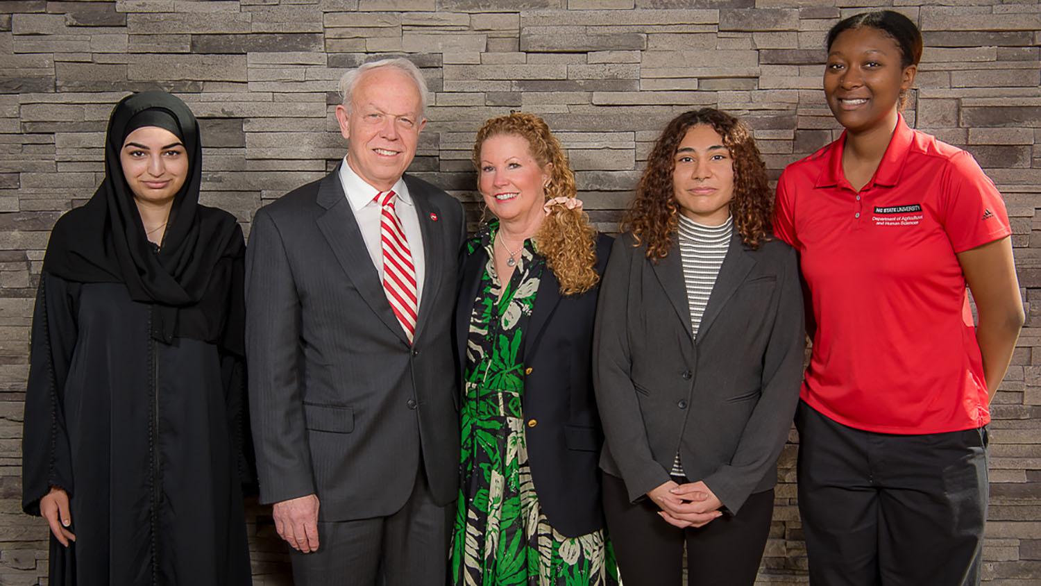 Joe (second from left) and Debbie (center) Gordon with three STEAM students.